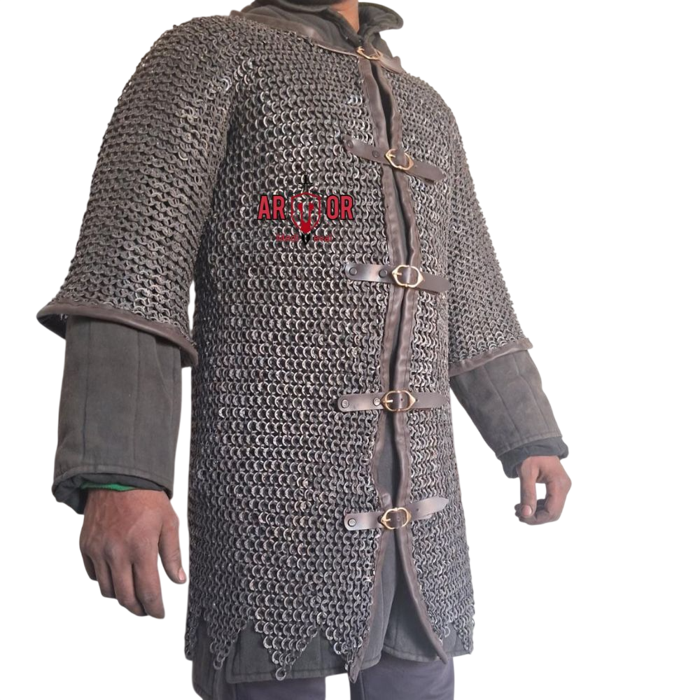 May include: A grey chainmail hauberk featuring a dark brown leather trim along the edges and four horizontal leather straps with brass-toned metal buckles down the front. The text "ARMOR" is printed in red on the chest of the metal link garment.